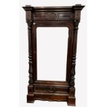 French stained walnut armoire wardrobe, frieze with leaf carved applied roundel, over bevelled mirro