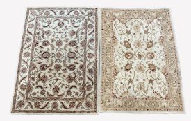 Chinese machined wool cream ground rug, decorated with interlaced foliate, (240cm x 165cm) and anoth