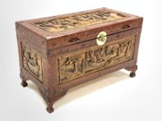 20th Century Chinese Camphor chest, plain interior, carved with seafaring vessels, raised on masked