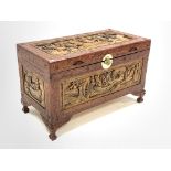 20th Century Chinese Camphor chest, plain interior, carved with seafaring vessels, raised on masked