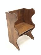 Pitch pine single seat pew, with seat panel raised on shaped panel end supports, W62cm