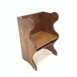 Pitch pine single seat pew, with seat panel raised on shaped panel end supports, W62cm