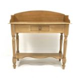 Victorian pine wash stand, with three quarter galleried top over single drawer, raised on turned sup