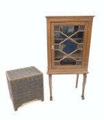 Early 20th century walnut display cabinet, with astragal glazed door enclosing two shelves, raised o