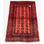 Persian design red ground rug, repeating gul motif on red field enclosed by multi line border,100cm