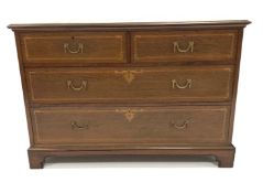Early 20th century mahogany chest fitted with two short and two long drawers, with satinwood banding