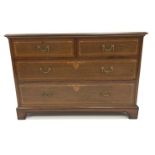 Early 20th century mahogany chest fitted with two short and two long drawers, with satinwood banding