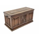 20th century pitch pine blanket box, panelled and carved with linen folds, wrought metal carry handl