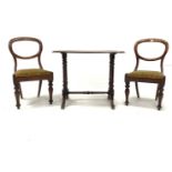 Pair of Victorian mahogany balloon back dining chairs, with drop in upholstered seat pads, raised on