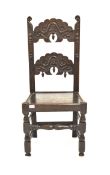 19th century oak Wainscot chair, with scroll carved back rails, panelled seat, raised on turned and