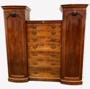 Large Victorian mahogany triple wardrobe, fitted with a bank seven graduated drawers flanked by two