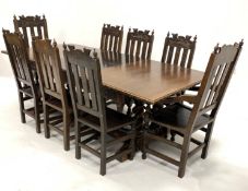 Early 20th century large dark oak extending dining table, the carved rectangular top raised on four