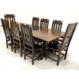 Early 20th century large dark oak extending dining table, the carved rectangular top raised on four