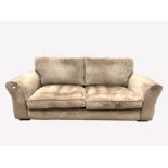 Contemporary three seat sofa, upholstered in brown chenille fabric, with squab cushions, raised on b