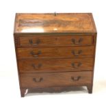 Georgian mahogany bureau, cross banded and string inlaid sloped front falling to reveal well fitted