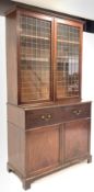 George III mahogany secretaire bookcase, glazed doors with brass grill enclosing three adjustable sh