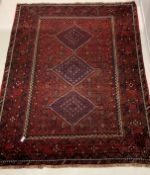 Persian hand knotted ground carpet, with pole medallion on red field, enclosed by multi line border,