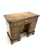 Early 20th century Georgian style burr walnut kneehole desk/dressing table, cross banded top over on