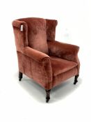 Georgian design wingback armchair, upholstered in velvet, raised on cabriole supports and castors, W