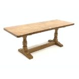 'Mouseman' Yorkshire oak oblong occasional table, with adzed top raised on octagonal turned supports