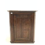 19th century oak corner cupboard, with panelled door enclosing shelves, W80cm