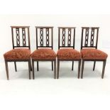 Set four Edwardian mahogany dining chairs, with inlaid cresting rail and pierced splats over red flo