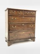 19th century oak chest fitted with two short and three lon graduated drawers, brass swan neck pull h