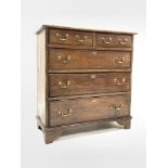 19th century oak chest fitted with two short and three lon graduated drawers, brass swan neck pull h