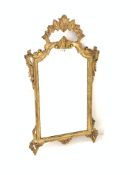Gilt framed upright wall mirror, with scrolled floral and shell decoration to frame, 61cm x 110cm