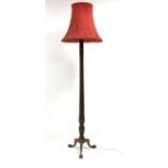 20th century Gillows design standard lamp, with decorative red damask shade raised on water leaf car