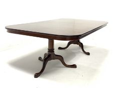 Late 20th century well figured mahogany twin pedestal dining table, the top raised on ring turned pe