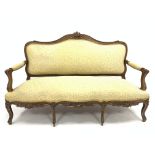 Victorian French style walnut canape, with gilt floral carved cresting rail over scrolled and acanth