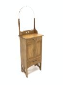 Arts and Crafts style light oak wash stand cabinet, with raised back over two drawers and a cupboard