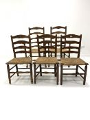 Set of five (2+3) oak ladderback dining chairs, with rush seats, raised on turned supports and stret