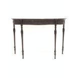 Rosewood serpentine console table, frieze intricately carved with interlaced foliate and acanthus le