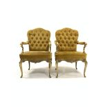 Pair of Italian cast brass open armchairs, seat and back upholstered in yellow velvet, the frame wit