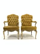 Pair of Italian cast brass open armchairs, seat and back upholstered in yellow velvet, the frame wit