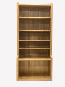 'Mouseman' Yorkshire oak open bookcase, with four fixed and one adjustable shelf, carved with mouse