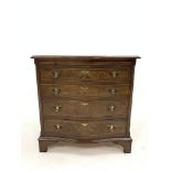 Georgian style walnut serpentine fronted chest, with brushing slide over four graduated drawers encl