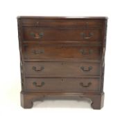 Early 20th century walnut chest, with brushing slide over four drawers, canted corners with applied