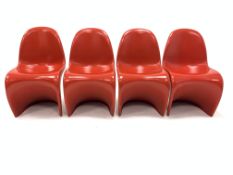 After Verner Panton - Set four moulded poly stacking chairs, finished in red, W49cm