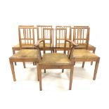 Set of 7 (6+1) 'Acornman' dining chairs, with drop in upholstered seat pads raised on square tapered