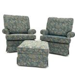 Parker Knoll - Pair of armchairs upholstered in blue floral fabric, and raised on castors, W87cm wit