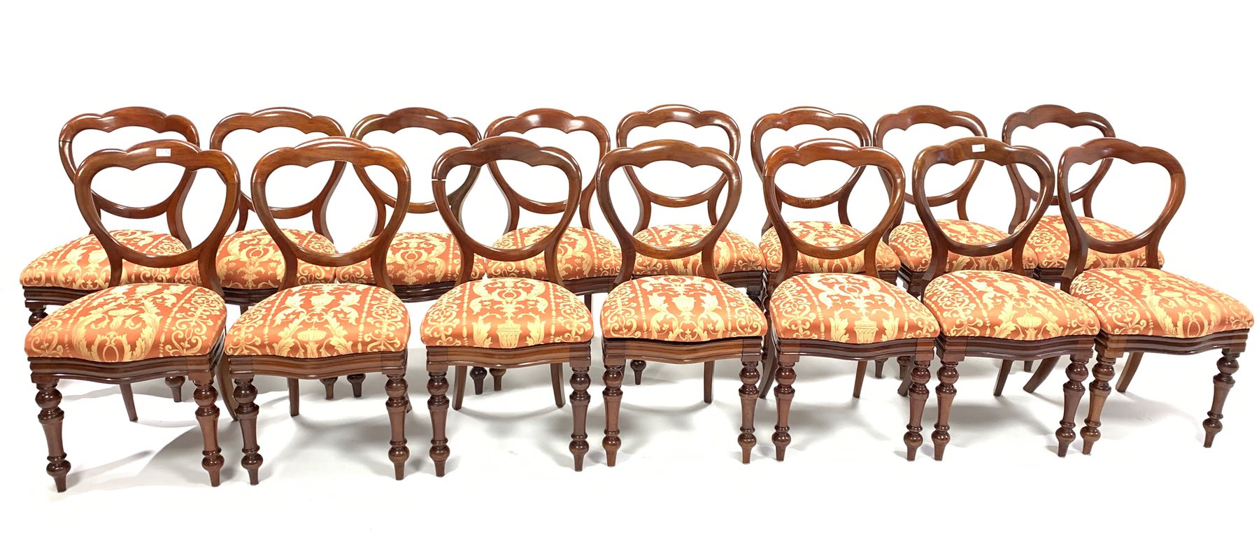 Set 15 Victorian mahogany balloon back dining chairs, with red floral damask covered drop in seat pa