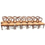 Set 15 Victorian mahogany balloon back dining chairs, with red floral damask covered drop in seat pa