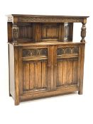 Early 20th century oak court cupboard, moulded cornice above scroll carved frieze, turned and carved