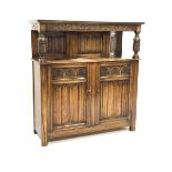 Early 20th century oak court cupboard, moulded cornice above scroll carved frieze, turned and carved