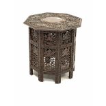 Indian hardwood octagonal occasional table, with brass inlaid top and incised elephants and interlac