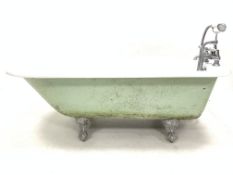 Victorian style enamelled cast iron roll top bath, with chrome plated Monoblock tap fitting, raised