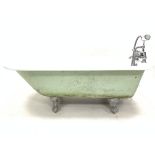 Victorian style enamelled cast iron roll top bath, with chrome plated Monoblock tap fitting, raised